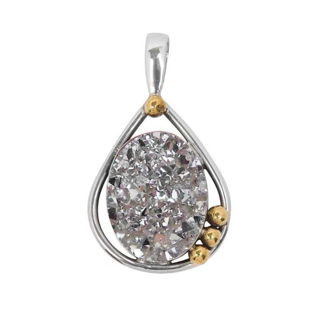 The Poppy Pendant Small by Gallardo & Blaine Designs features a teardrop-shaped sterling silver design with an oval, textured sparkling gemstone, accented by gold spheres—a beautifully elegant jewelry piece.
