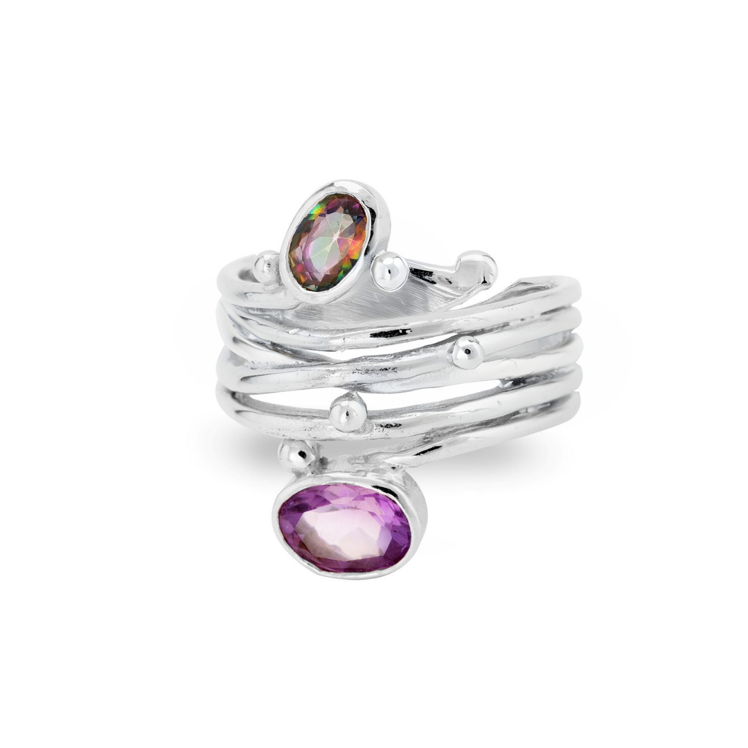 Gallardo & Blaine Designs' Snake Ring in Silver Gold features a textured, layered band accented with two oval gemstones—one multicolored, one purple—and small silver beads.