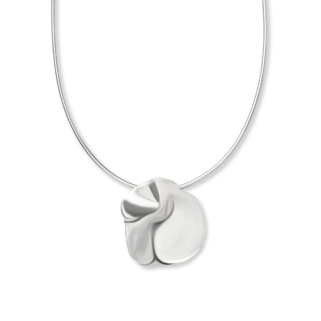 A sleek silver Tide Necklace by Madeleine Blaine, showcasing a polished, abstract crumpled pendant on a refined chain, expertly hand-carved in Dublin and reflecting the artistry of Irish jewelry, set against a white background.