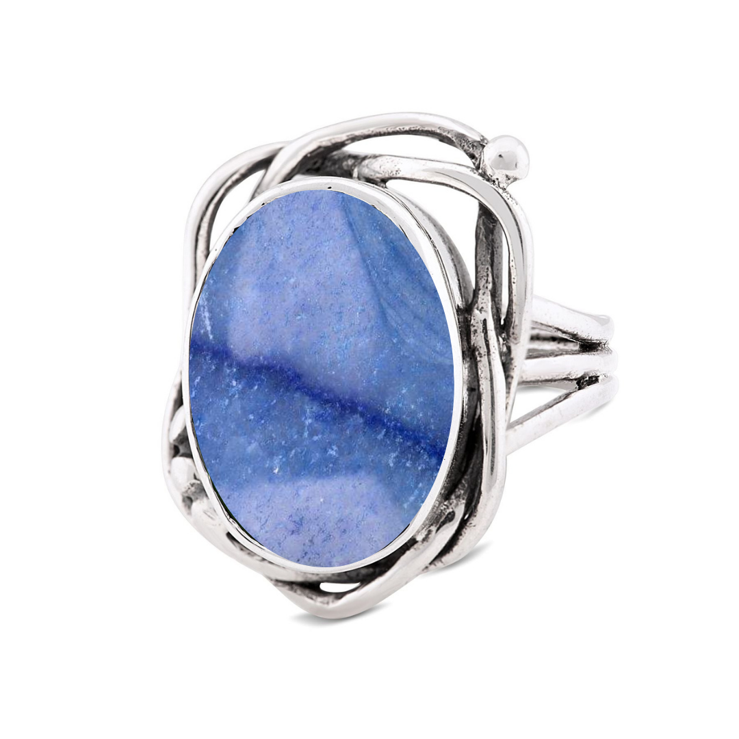 The Whirlpool Ring by Gallardo & Blaine Designs features an oval blue marbled gemstone set in an intricate, twisted silver band.
