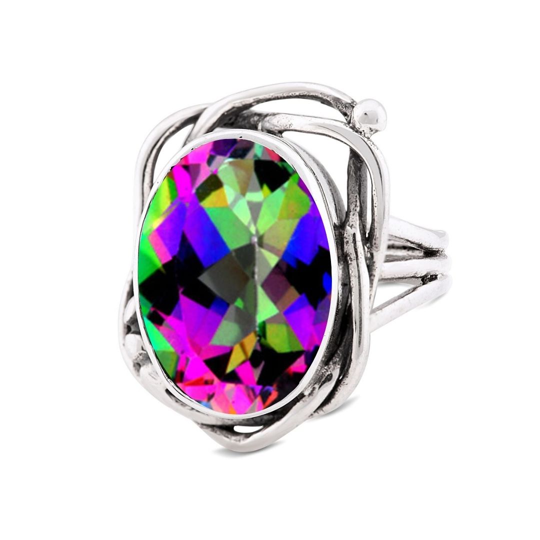 The Gallardo & Blaine Designs Whirlpool Ring features an oval, faceted gemstone in vibrant hues, set in a silver band with an intricate swirling design.