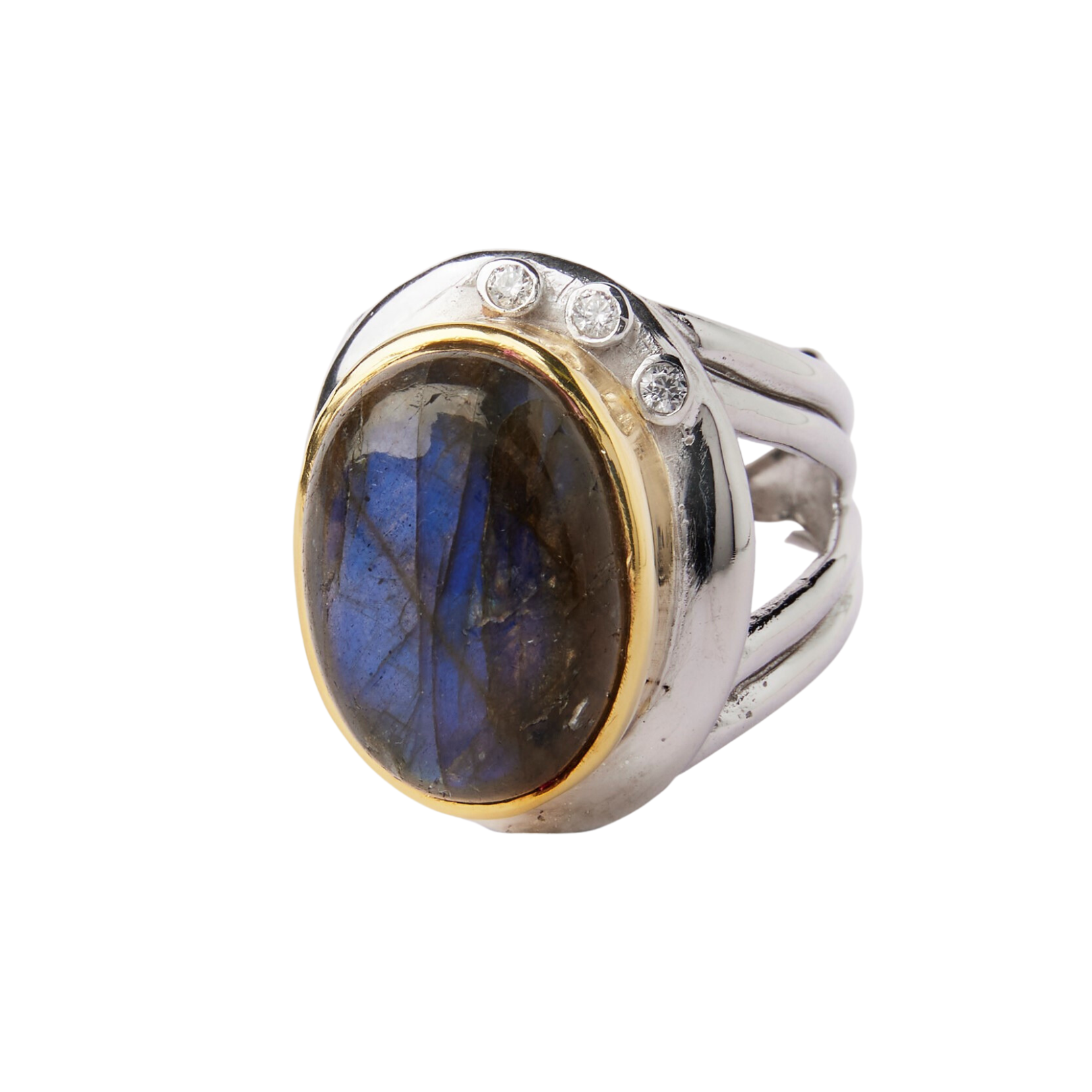 The Eyetelia Ring in various gemstones by Gallardo & Blaine Designs features an oval-shaped labradorite stone, encased in a golden bezel setting with three small diamonds on the top side of the stone. This statement cocktail ring boasts a bold, chunky des