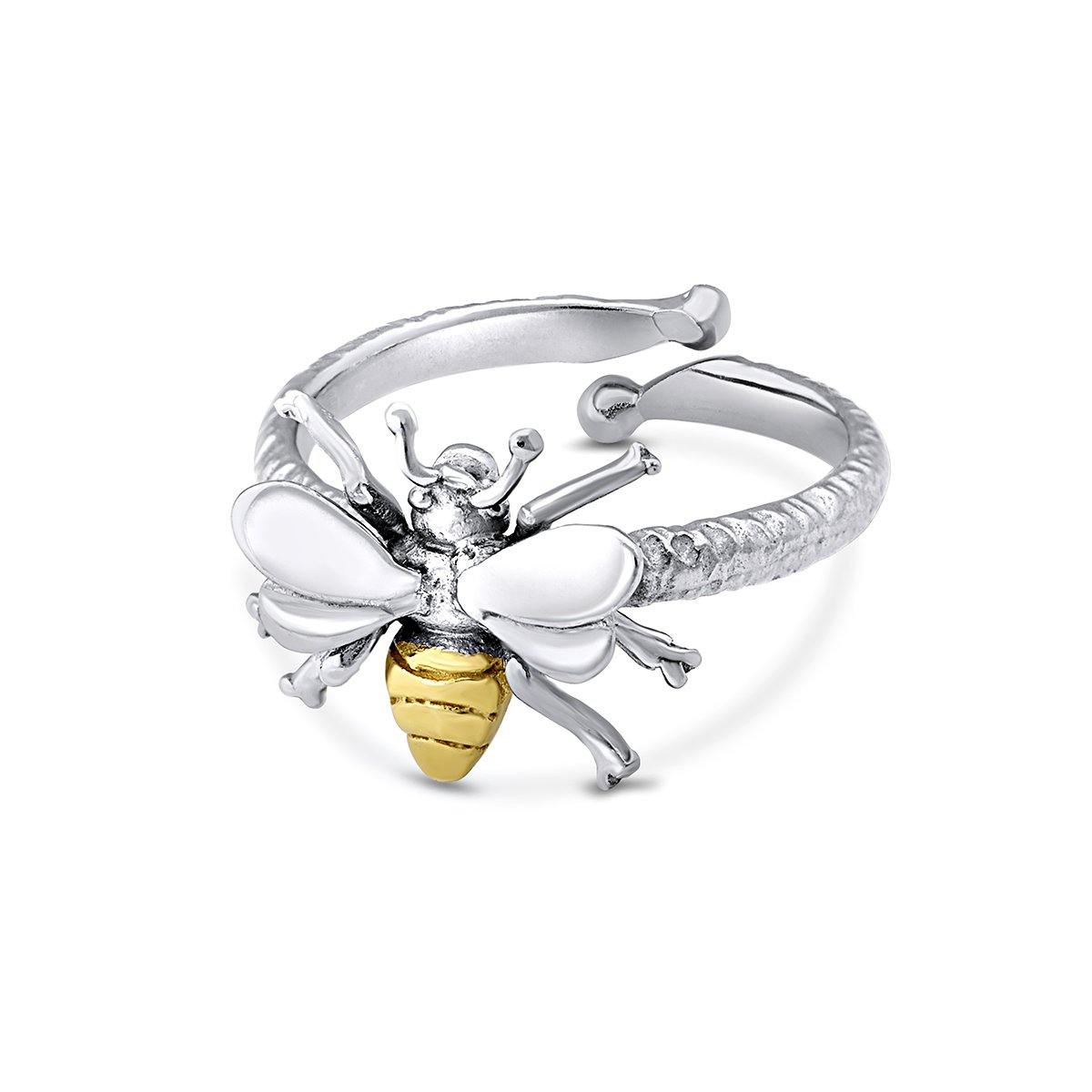 The Wildlife Bee Ring Silver & Gold by Watermelon Tropical features a detailed bee with shiny white wings and a gold and black striped body—an elegant, nature-inspired adjustable ring set against a plain white background.
