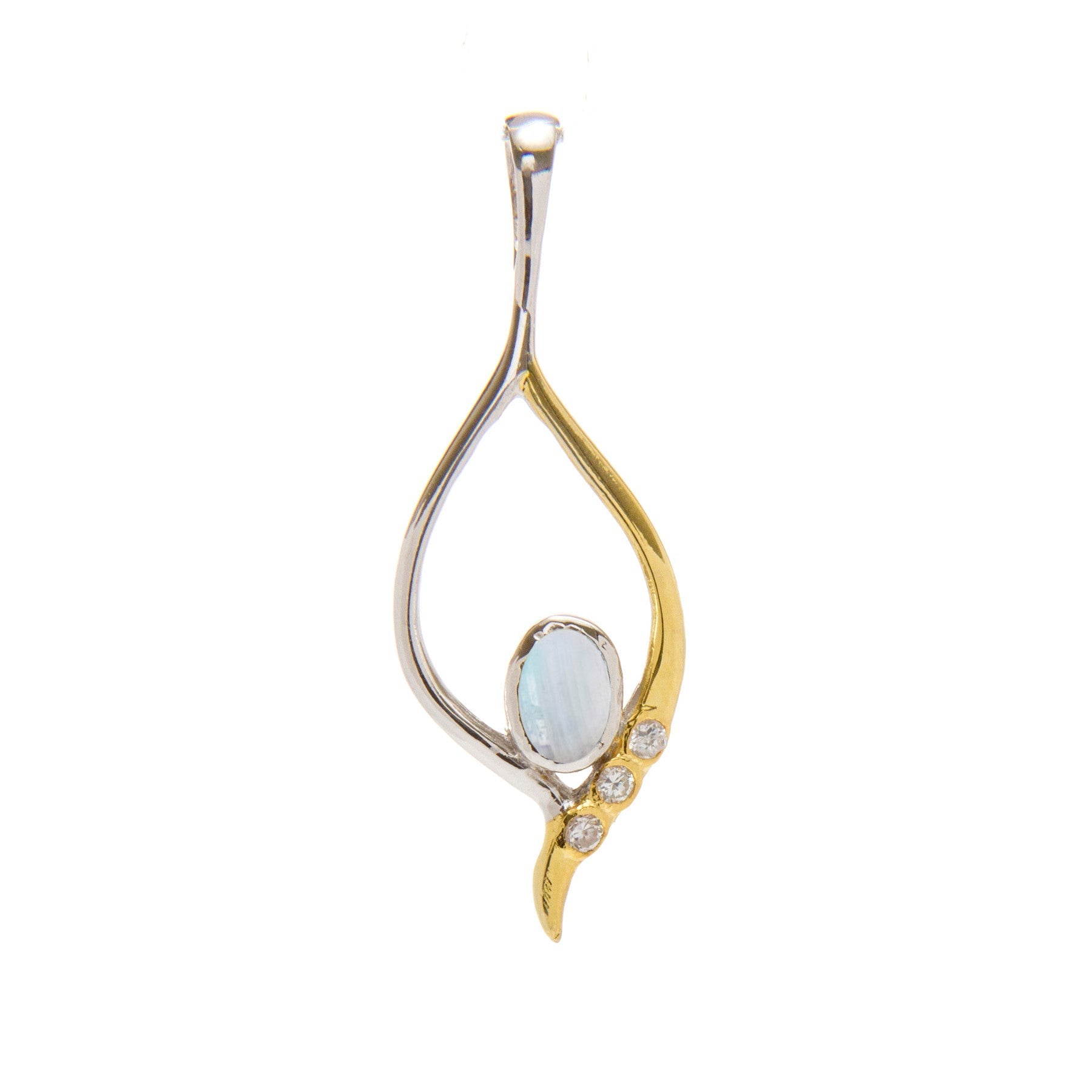 The Desert Star Pendant in various gemstones by Gallardo & Blaine Designs is crafted with a combination of sterling silver and gold vermeil, forming an elegant open teardrop shape. The design features an opalescent oval gemstone at its center, accompanied