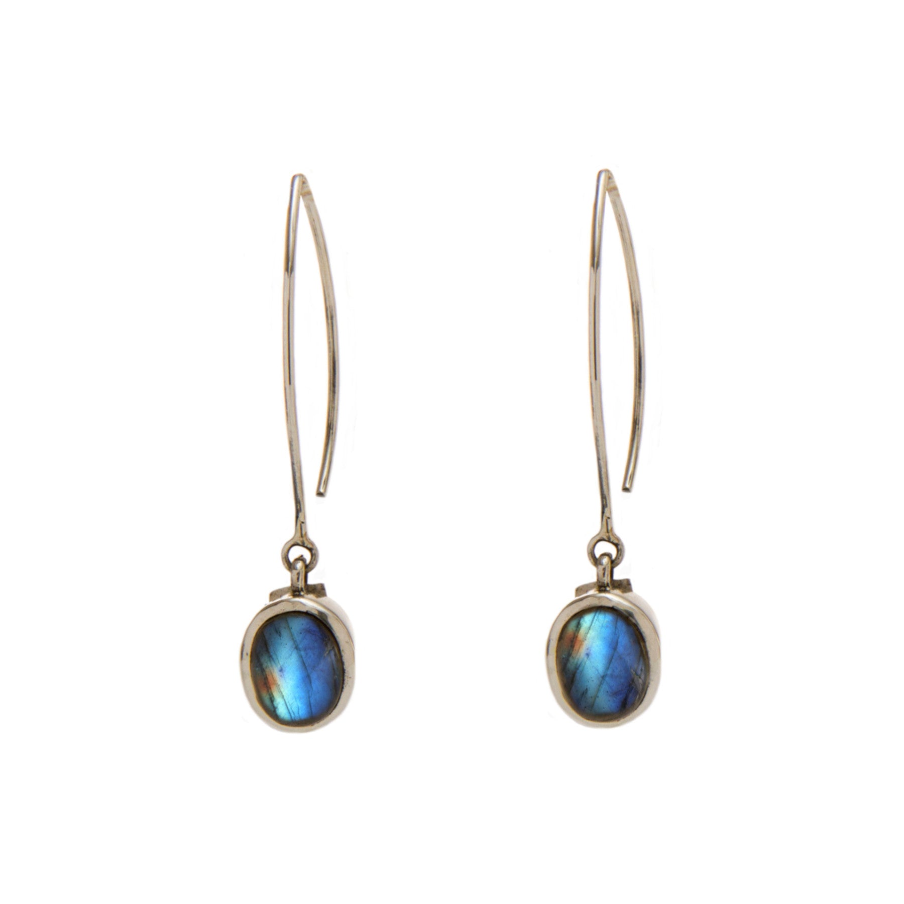 A pair of elegant Dew Drop Earrings in various gemstones featuring oval-shaped labradorite stones set in simple metal frames by Gallardo & Blaine Designs. The labradorite exhibits iridescent hues of blue and green. The earrings have thin, elongated hooks