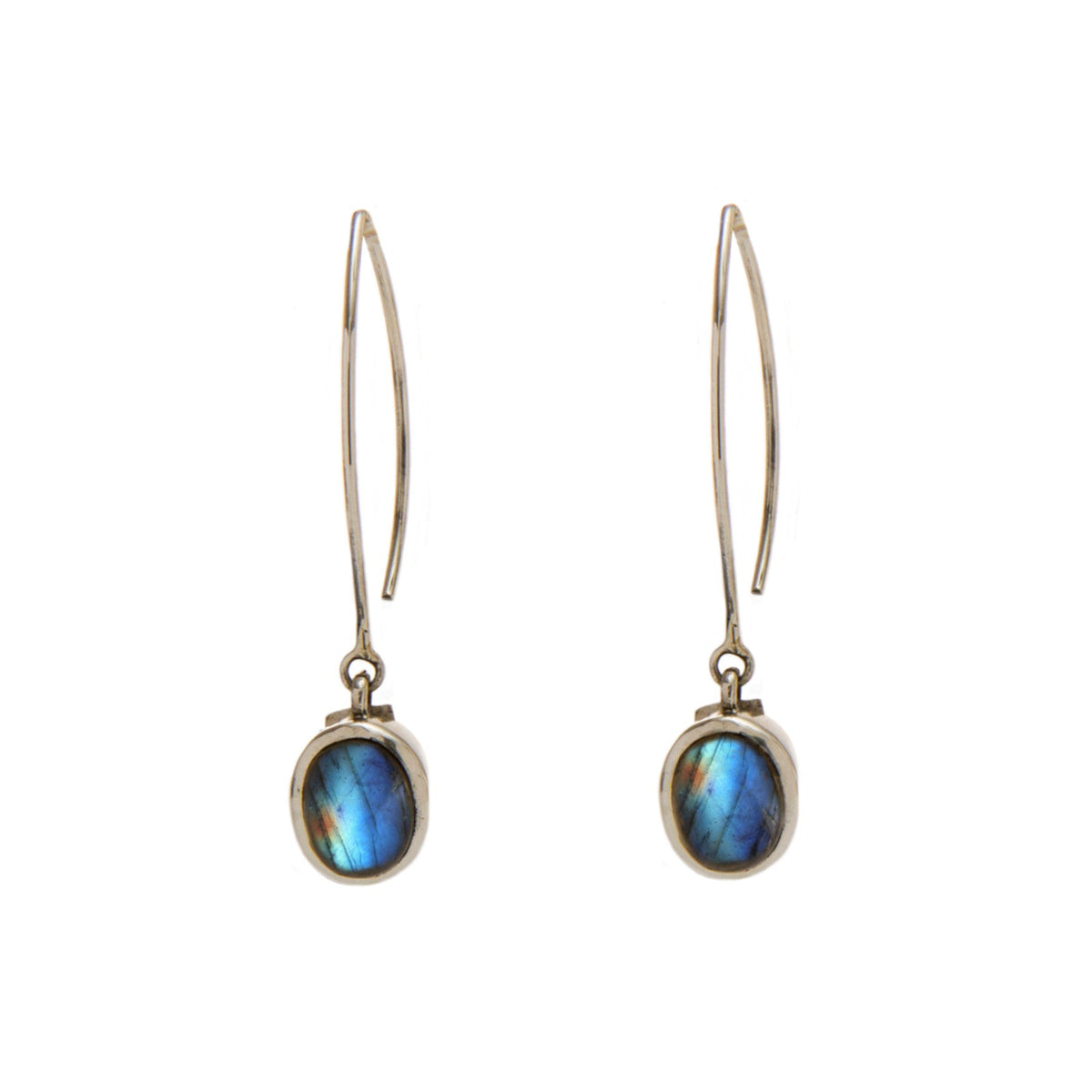 A pair of elegant Dew Drop Earrings in various gemstones featuring oval-shaped labradorite stones set in simple metal frames by Gallardo & Blaine Designs. The labradorite exhibits iridescent hues of blue and green. The earrings have thin, elongated hooks