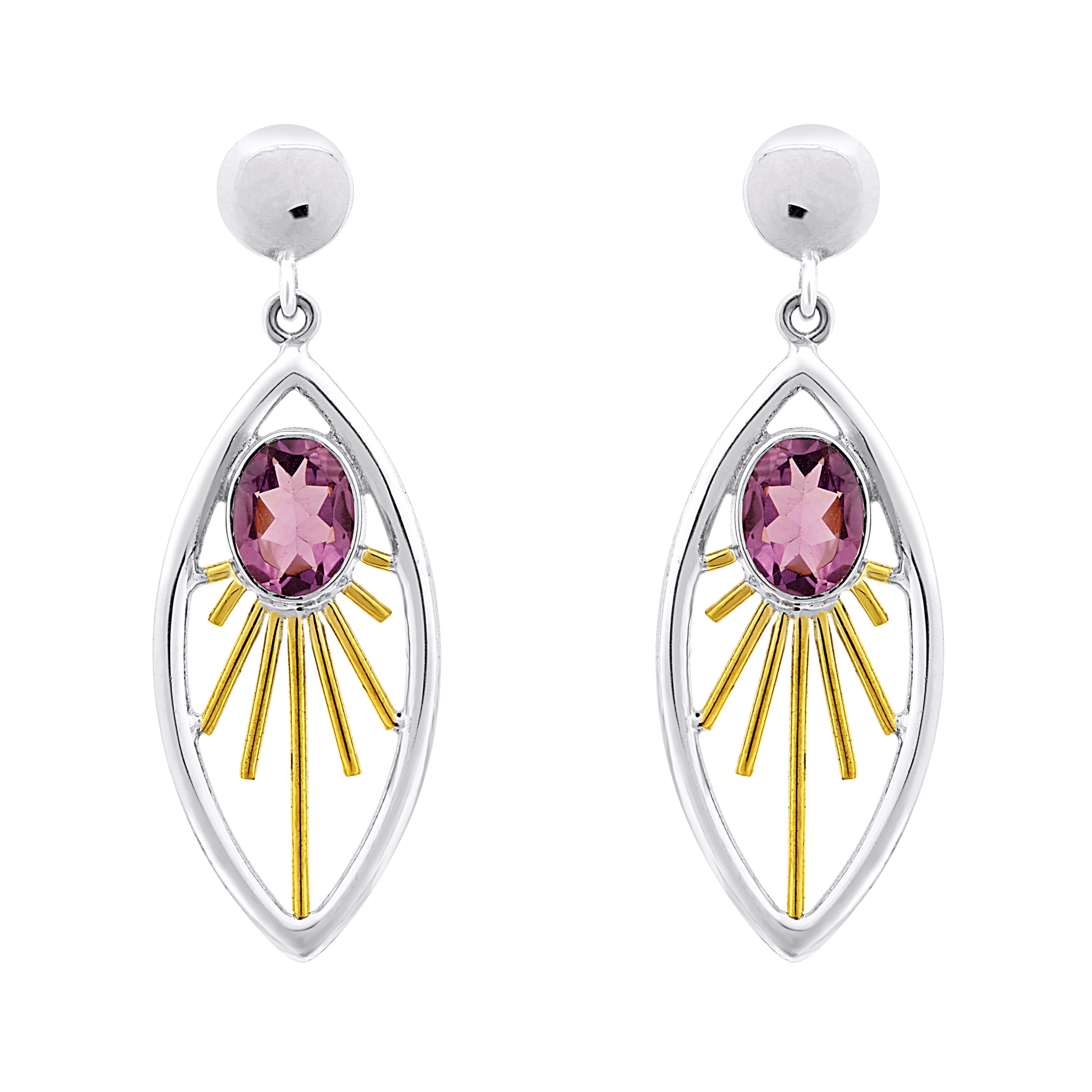 A pair of elegant Goddess Earrings in various gemstones featuring an oval-shaped pink gemstone at the center. The gemstone is set within a sterling silver & gold frame adorned with rays extending outward, resembling a radiant sunburst. These exquisite gem