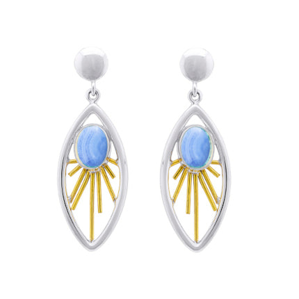 A pair of elegant **Goddess Earrings in various gemstones** by **Gallardo & Blaine Designs** featuring a sterling silver oval-shaped frame with a central light blue stone. Gold decorative elements radiate out from the gemstone drop, resembling sun rays. T