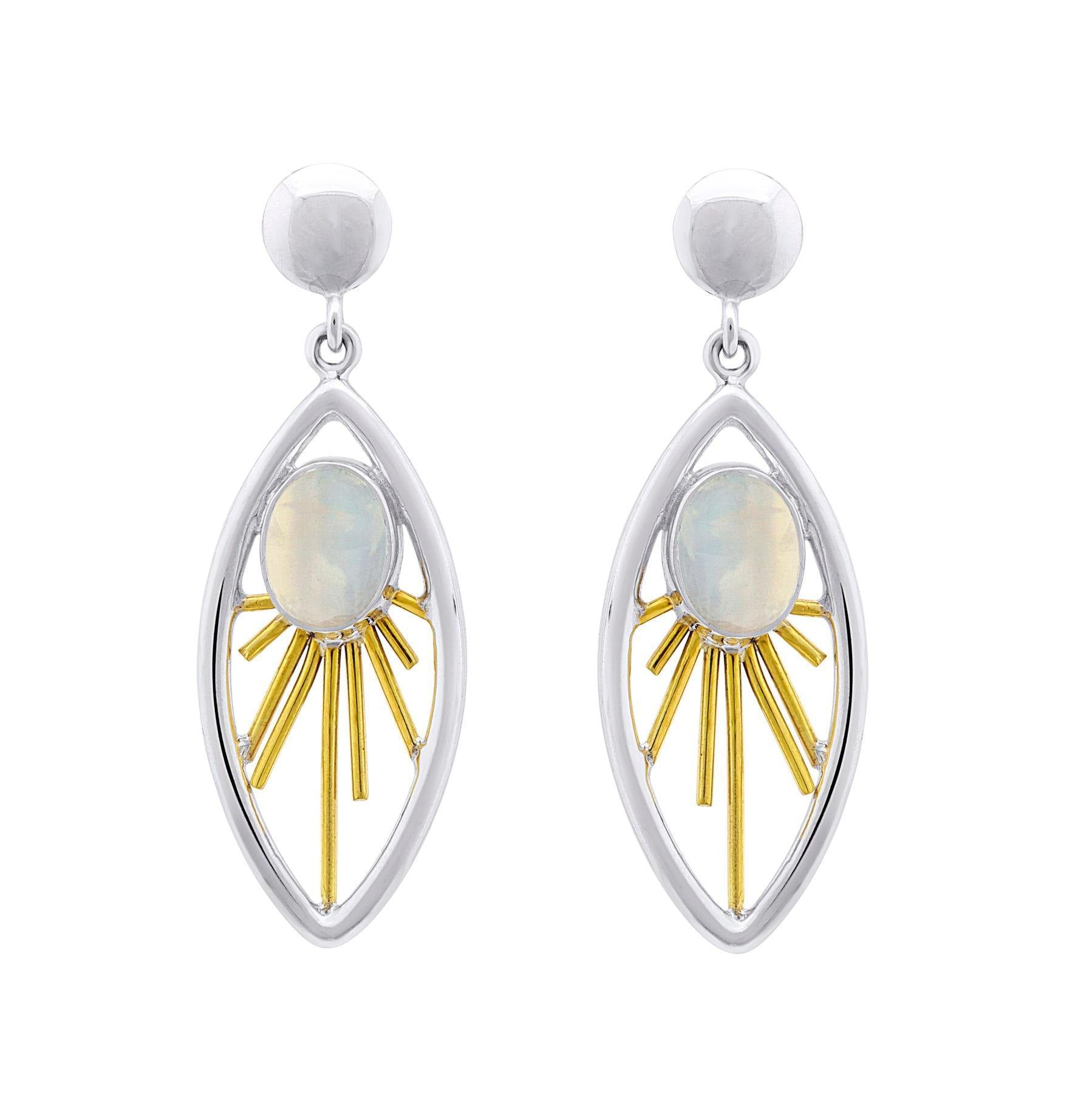 A pair of elegant Goddess Earrings in various gemstones featuring a sterling silver & gold marquise-shaped frame. Inside the frame, there's a central oval opalescent stone surrounded by radiating gold-toned bars, mimicking sun rays. These exquisite gemsto