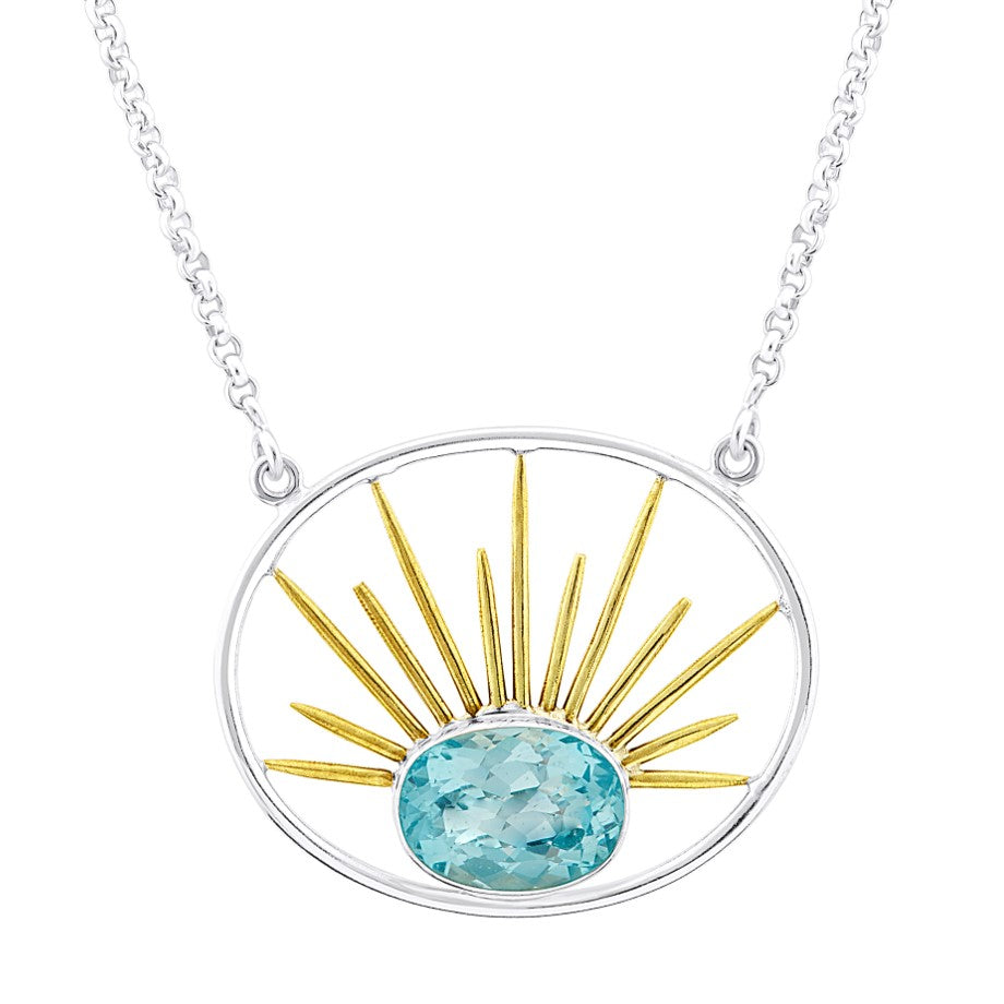 A silver necklace with a circular turquoise stone pendant at the bottom center, surrounded by golden sunbeam-like spikes in a sunburst design. The chain is delicate and made of gold vermeil, specifically the Goddess Necklace Large in Various Gemstones fro