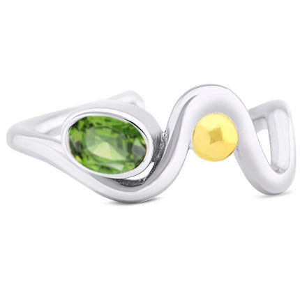 A stunning sterling silver wave-shaped ring featuring an oval green gemstone and a round gold accent. This Adjustable Heartbeat Ring by Gallardo & Blaine Designs places the green gemstone at one end of the wave, while the gold accent graces the center of