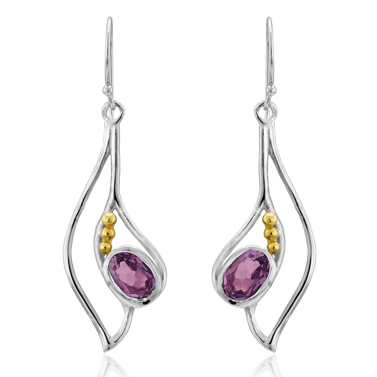 The Iris Earrings in various gemstones by Gallardo & Blaine Designs are a pair of silver & gold drop earrings featuring an organic, wavy design. Each earring has an oval-shaped purple gemstone set in the center and accented with three small gold beads on