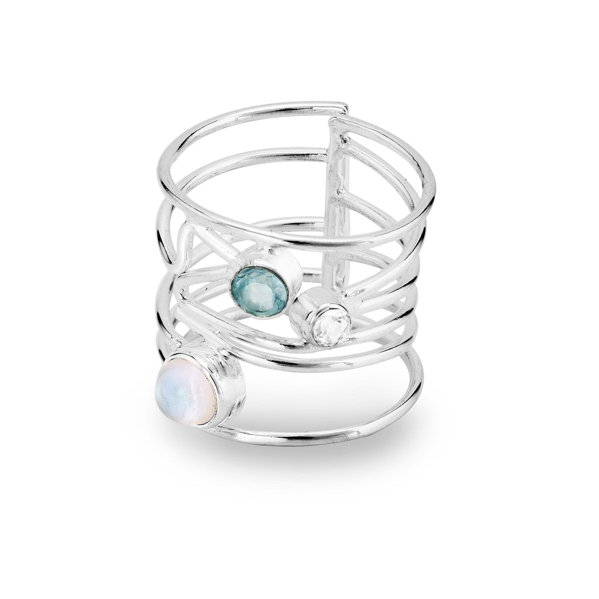 A Lattice Ring in various gemstones by Gallardo & Blaine Designs featuring three gemstones: a white opal, a blue topaz, and a clear quartz. The band has an open, lattice design with the stones set at different points across the layers, creating a contempo