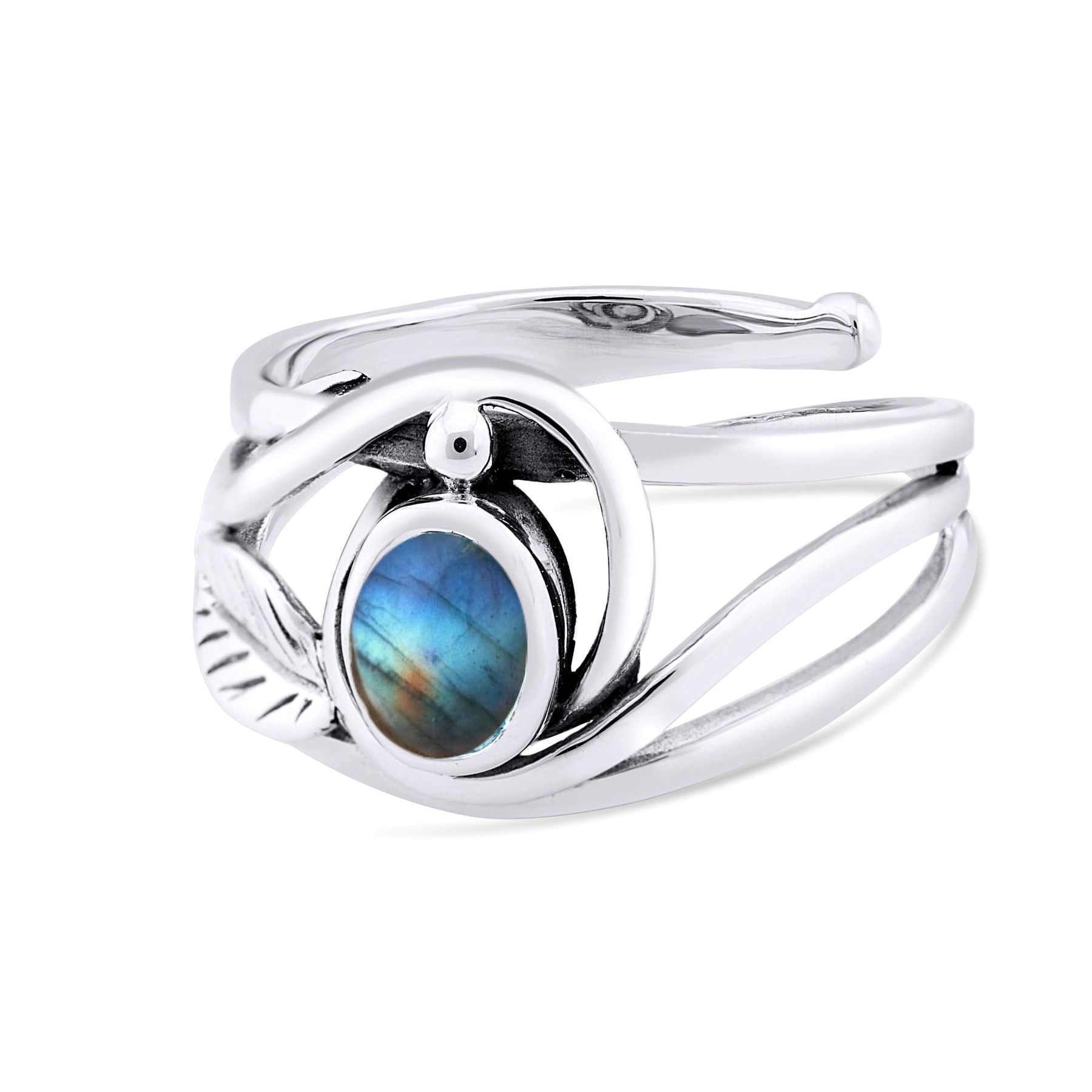 The Leaf Ring in Silver Gold & various gemstones by Gallardo & Blaine Designs features a unique, intertwined band design, with an oval-shaped labradorite gemstone set in the center. The gemstone displays a range of iridescent colors, mainly blue and green