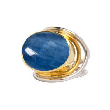 A sterling silver and gold adjustable ring featuring a large, oval-shaped blue gemstone. The design consists of intertwined metal bands accentuating the central stone. The glossy blue gemstone reflects light beautifully, making the Party Ring in various g