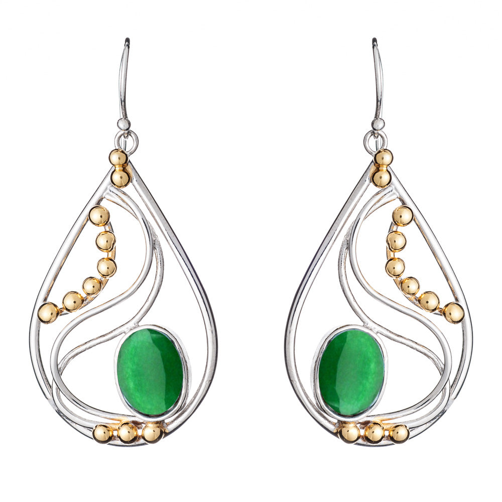 The Phoenix Earrings in various gemstones by Gallardo & Blaine Designs are a pair of elegant drop earrings featuring silver frames with decorative gold beads. Each earring showcases a large oval green stone set in the center, surrounded by intricate silve