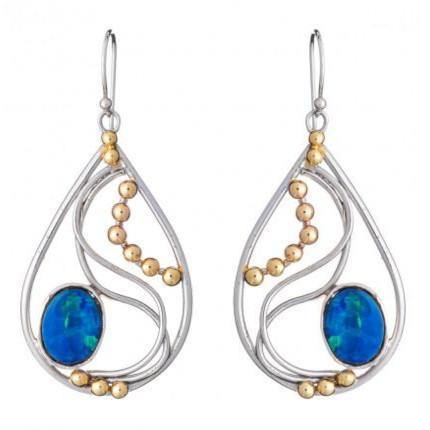 Introducing the Phoenix Earrings in various gemstones by Gallardo & Blaine Designs: a pair of elegant drop earrings featuring intricate silver wire designs with small gold bead accents and blue oval gemstones at the bottom center. These silver and gold ea