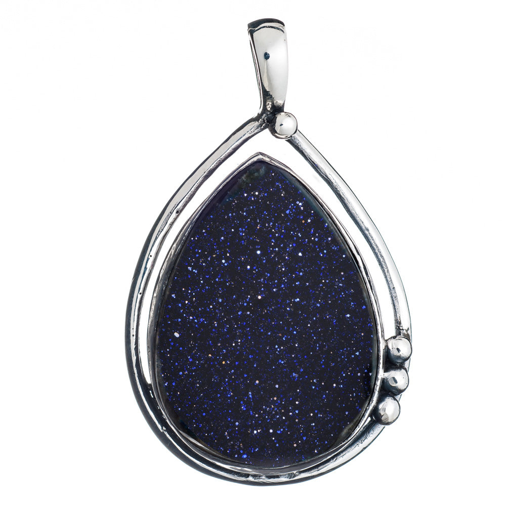 The Poppy Pendant Large in various gemstones from Gallardo & Blaine Designs features a teardrop-shaped blue goldstone, encased in a sleek, sterling silver frame. The blue goldstone sparkles with tiny flecks, giving it a starry night appearance. The minima