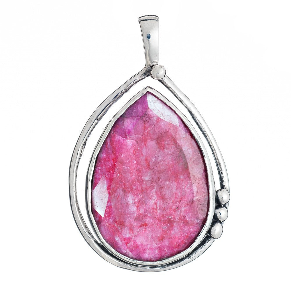 Introducing the Poppy Pendant Large in various gemstones by Gallardo & Blaine Designs, a teardrop-shaped piece featuring a vibrant pink gemstone encased in sleek sterling silver. The minimalist design includes three small silver accent beads on one side,