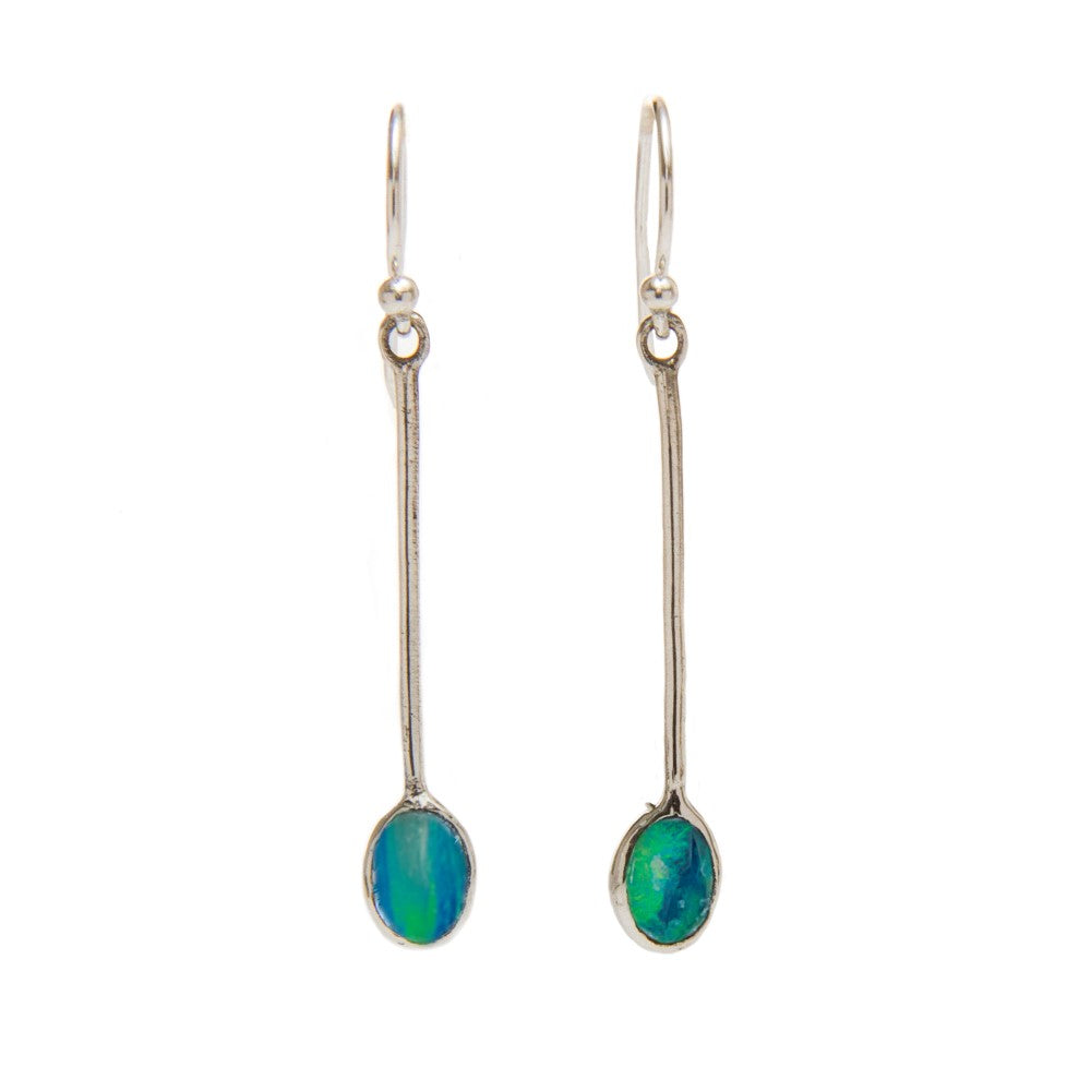 The Sequola Earrings in various gemstones from Gallardo & Blaine Designs are a pair of long, sterling silver drop earrings with slender metal stems, each featuring an oval-shaped blue-green gemstone at the end. These gemstone dangle earrings have a reflec