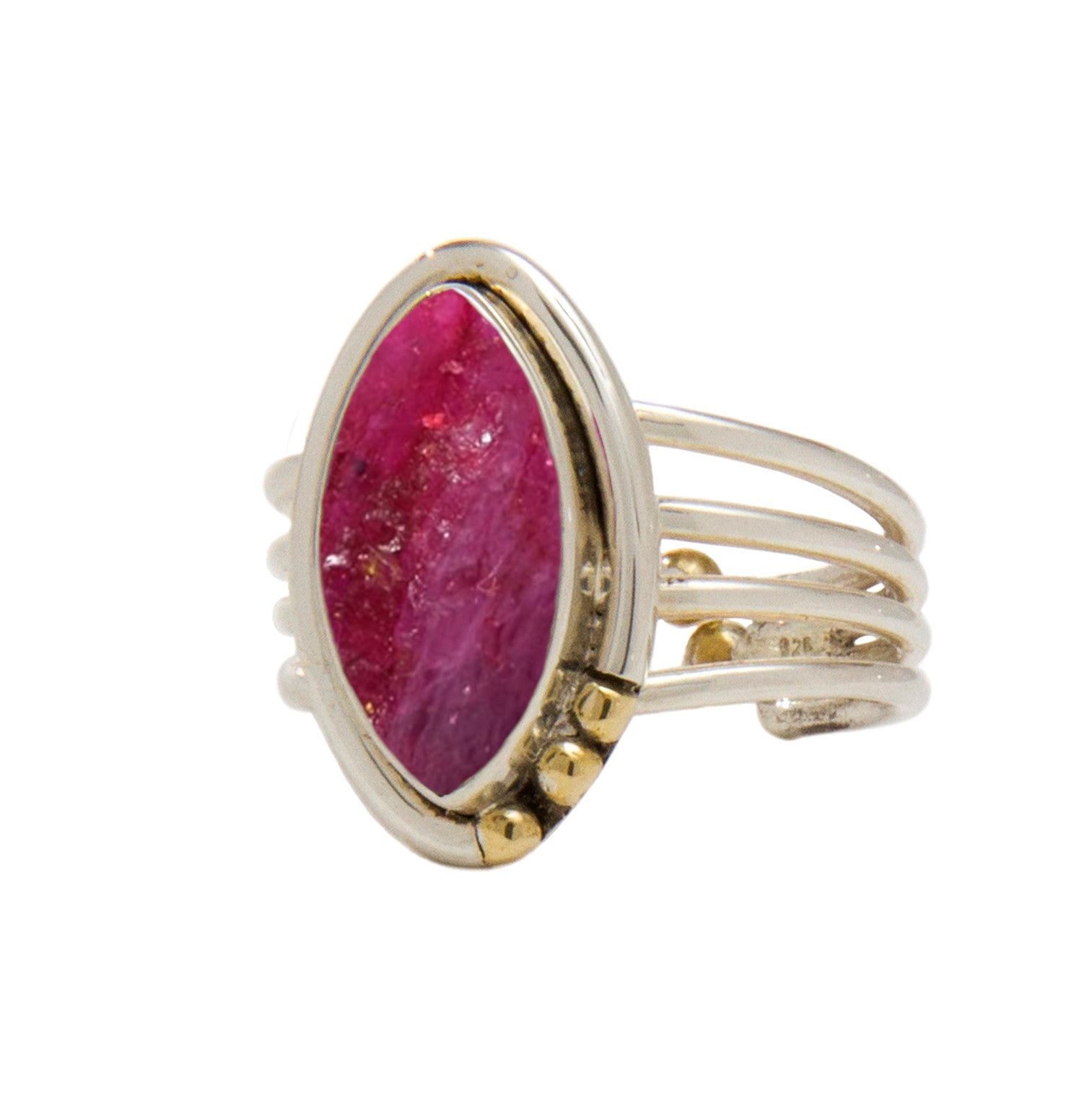 A gold, Art Deco adjustable ring featuring a large, oval-shaped pink gem set vertically in the center. The ring band consists of multiple thin, parallel bands joined together, with small gold accents on either side of the gemstone. This exquisite piece is