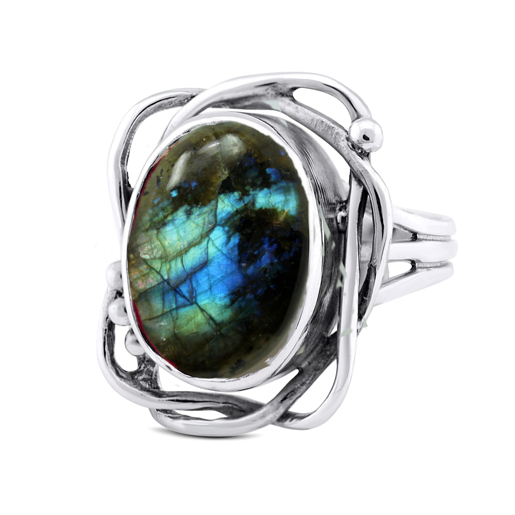 An adjustable silver ring with an oval labradorite gemstone. The gemstone showcases vibrant blue, green, and hints of yellow iridescence. The intricate silver setting features artistic swirls and loops around the gemstone, making this a stunning Whirlpool