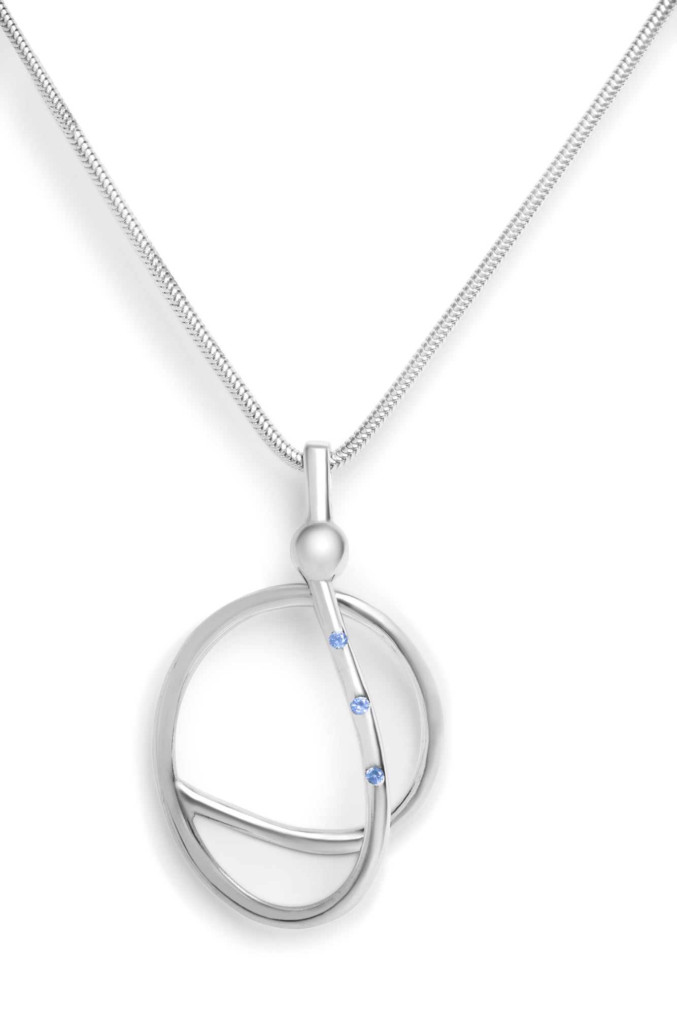 The Sea Honey Necklace by Gallardo & Blaine Designs features a modern sterling silver pendant with intersecting loops and three blue gemstones set along one curve.