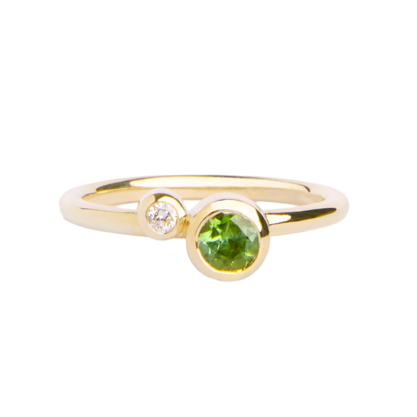 The Willow Shimmer 9ct yellow gold ring from Madeleine Fine Jewellery features a round green tourmaline and a sparkling diamond set side by side on a slim band.