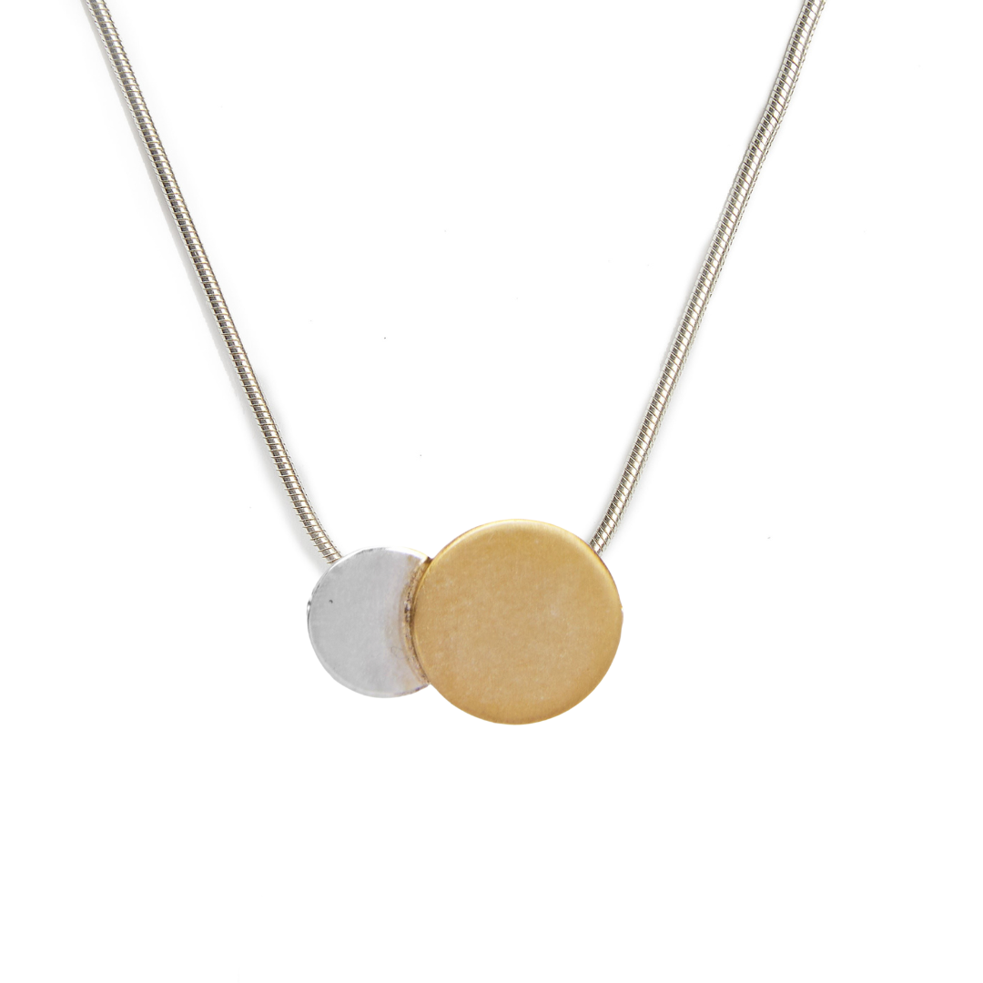 The Archeol Necklace in Sterling Silver & Gold Vermeil by Gallardo & Blaine Designs features a thin chain with overlapping silver and gold vermeil circles, showcasing minimalist style against a white background.