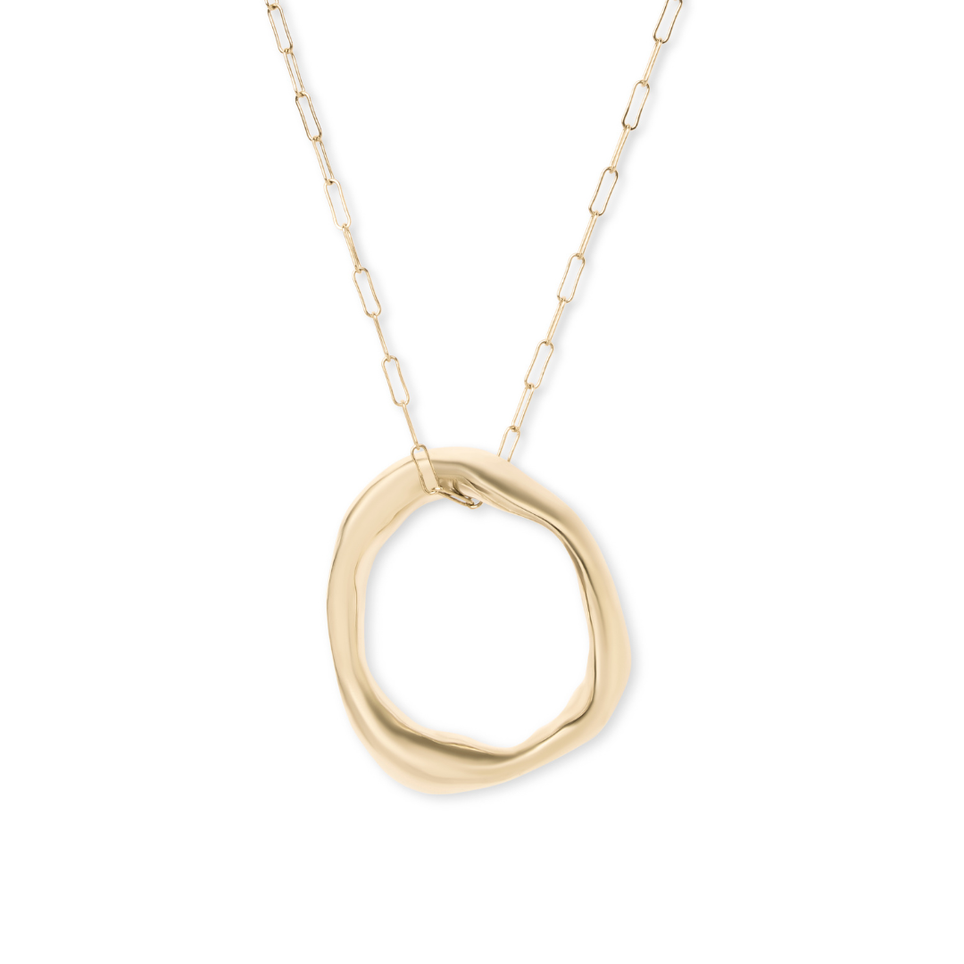 The Bough Necklace by Madeleine Blaine features a large, irregular open circle pendant on a delicate, elongated chain, drawing artistic inspiration from Irish oak jewelry and showcased against a plain white background.