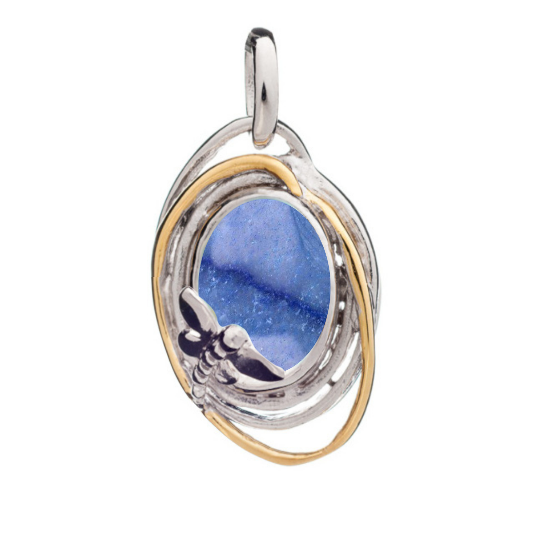 The Lagoon Pendant Small by Gallardo & Blaine Designs features a blue gemstone center, encircled by silver and gold loops, and accented with a delicate silver dragonfly for an elegant finish.