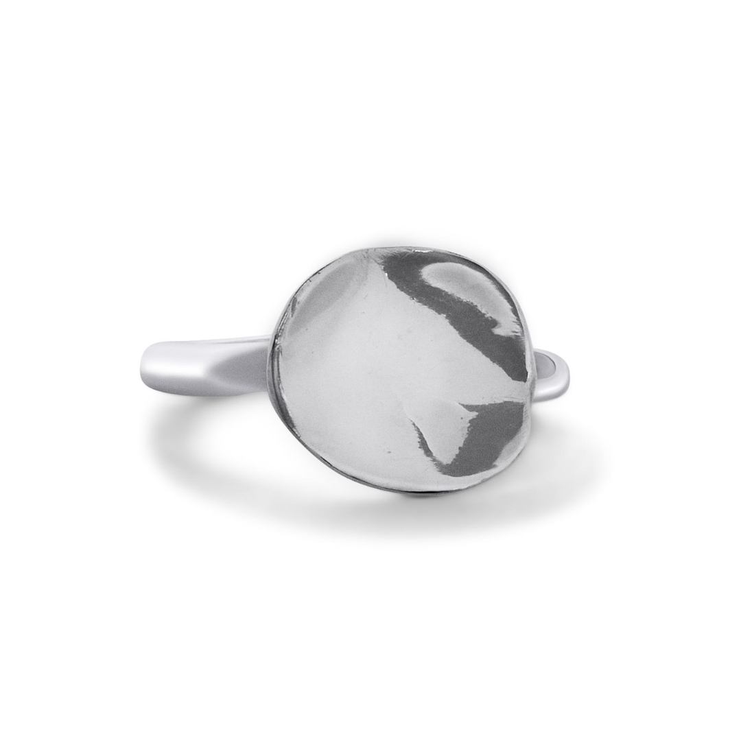 The Tide Ring by Madeleine Blaine is a silver ring with a smooth, round, and slightly domed top, featuring a highly polished, reflective surface—this lunar-inspired piece beautifully captures the ethereal allure of moonlight.