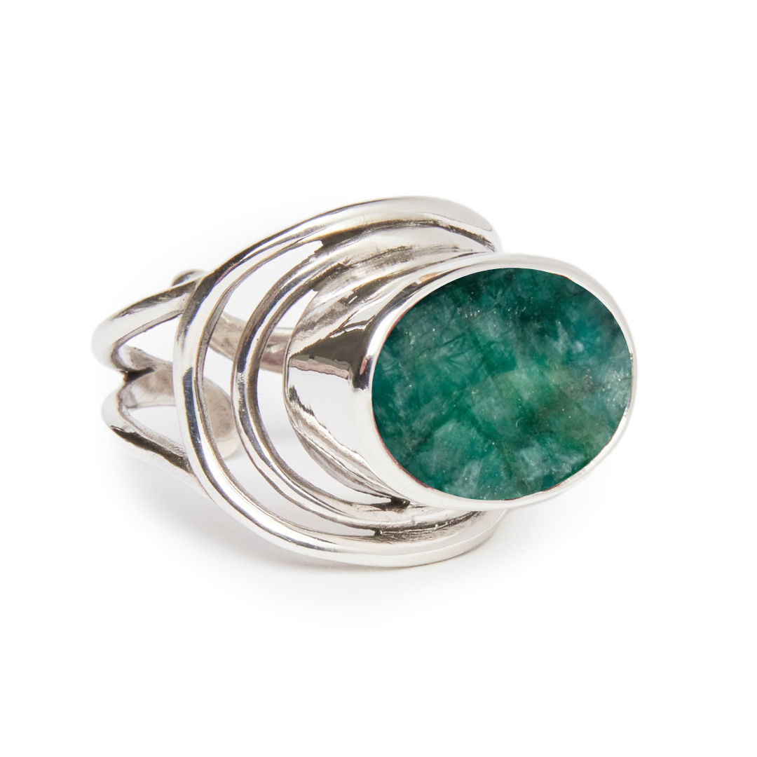 The Party Ring by Gallardo & Blaine Designs is a chunky silver statement ring with multiple bands, featuring an oval polished green gemstone elegantly elevated within its intricate design.
