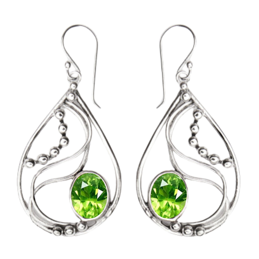 The Phoenix Earrings by Gallardo & Blaine Designs feature sterling silver teardrop shapes with swirl details, bead accents, and a large round green gemstone at the center.