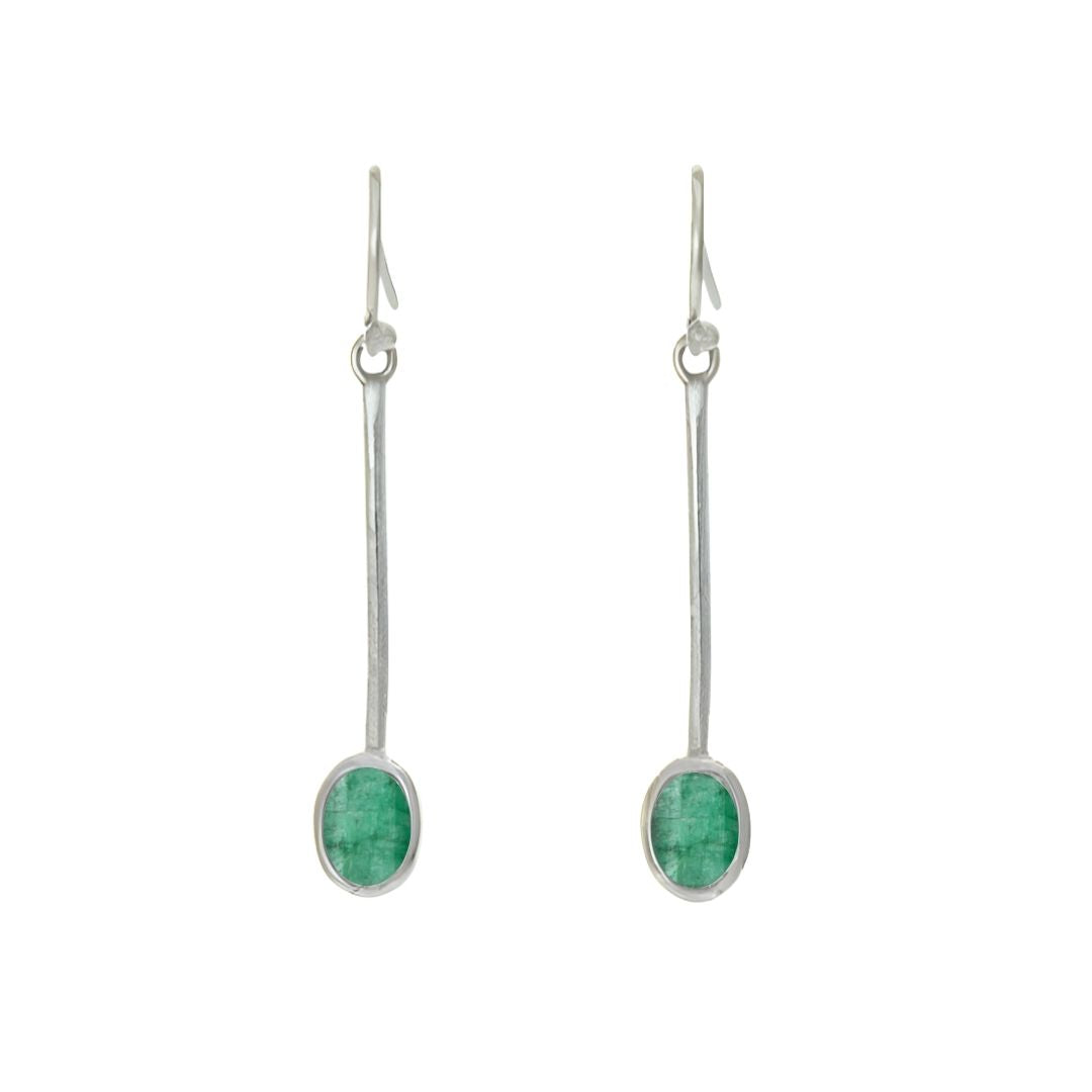 The Sequola Earrings by Gallardo & Blaine Designs feature two sterling silver drop earrings with long stems, each adorned with an oval green gemstone in sleek silver settings and fitted with hooks for wearing, offering a timeless charm through their simpl