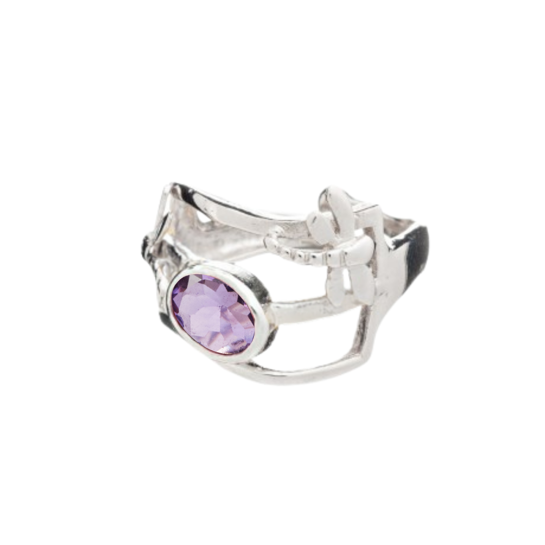 The Small Dragonfly Ring by Gallardo & Blaine Designs features silver and gold plating with an open, intricate design and a central oval-cut purple gemstone—a refined piece of gemstone jewelry.