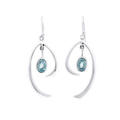 A pair of Gallardo & Blaine Designs Primrose Earrings in various gemstones featuring sterling silver and an elegant, flowing design with teardrop-shaped blue gemstones at their center. These earrings have a hook for wearing and showcase modern, minimalist