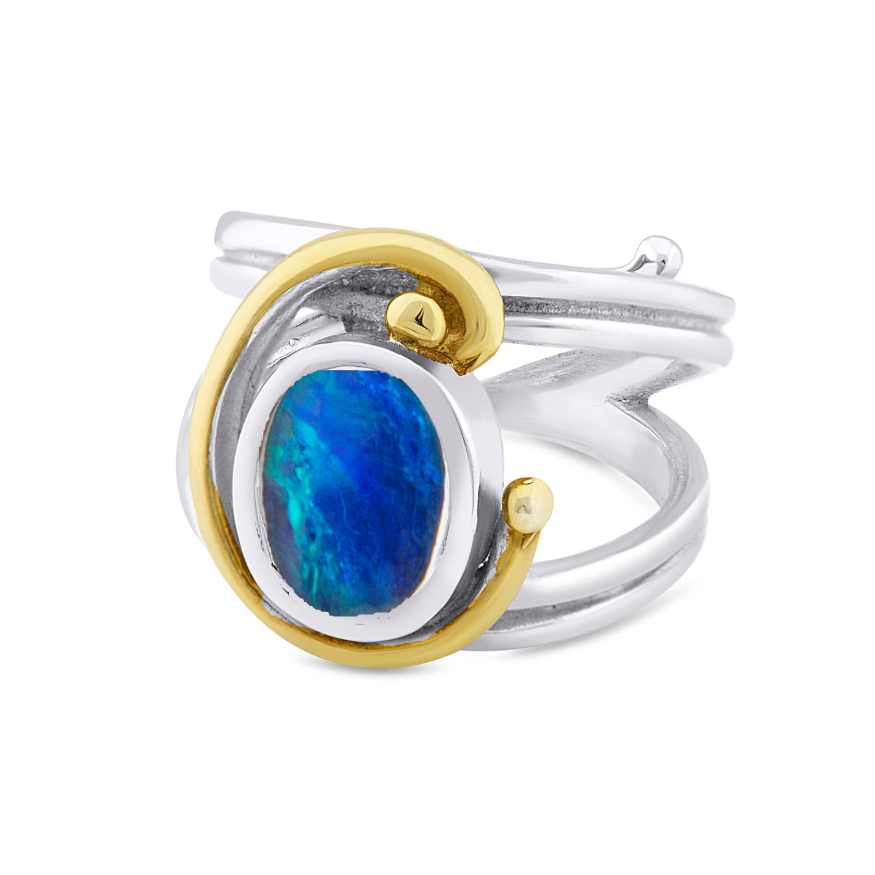 A **Jasmine Ring in various gemstones** by **Gallardo & Blaine Designs** is shown. It has a central oval blue gemstone accentuated by a surrounding gold swirl. The ring's design combines both smooth and textured metal elements, blending modern and classic
