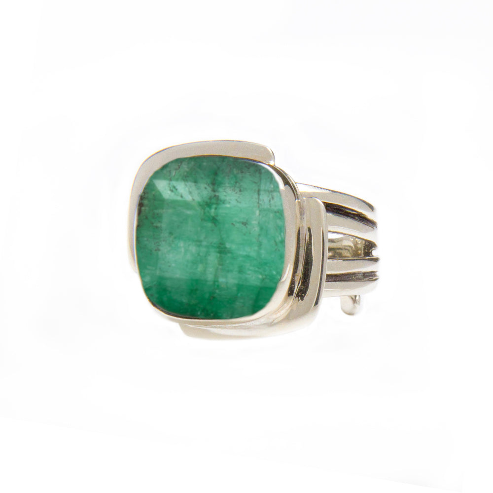 A Gallardo & Blaine Designs Art Deco Ring in Silver Gold & various gemstones featuring a large square-cut green gemstone held by a sleek and modern band design. The green gemstone is the focal point, contrasting beautifully against the polished silver ban