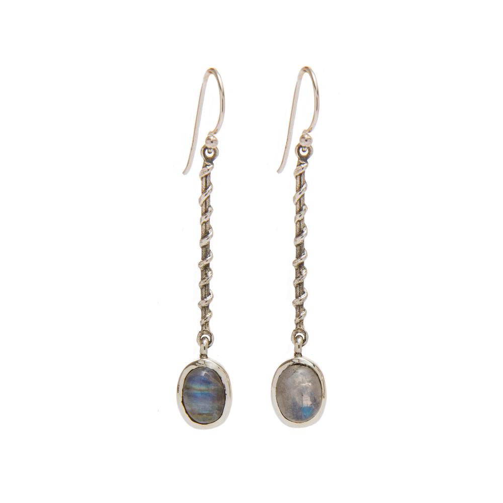 A pair of elegant, long dangle earrings featuring twisted sterling silver stems and pretty oval-shaped labradorite stone pendants. The stones have a blue and gray iridescence, providing a shimmering effect. These Gallardo & Blaine Designs Clematis Earring