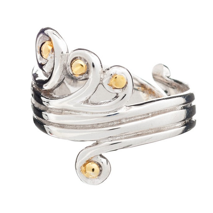 A **Crown Ring** with a swirling, intricate design featuring several small, round, gold vermeil accents. The adjustable sterling silver ring by **Gallardo & Blaine Designs** showcases a blend of silver and gold elements, creating an elegant and ornate app