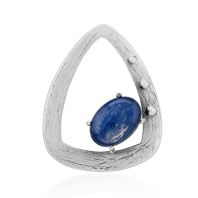 The Gallardo & Blaine Designs Delphin Pendant features a silver, triangular shape with a brushed finish, an off-center oval blue gemstone, and three small silver spheres accenting one side.
