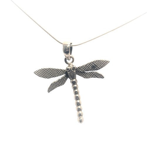 A silver pendant necklace featuring a detailed dragonfly design from our Wildlife Collection, the Wildlife Pendant - Large Dragonfly With Chain by Gallardo & Blaine Designs. The dragonfly pendant, with textured wings and a segmented body, is suspended ele