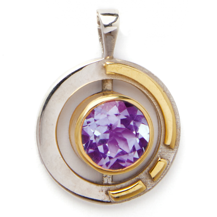The Elodie Pendant in silver gold & various gemstones by Gallardo & Blaine Designs showcases a large, faceted purple gemstone at its center. Sterling silver and gold vermeil elements create an intricate design, with silver forming a partial circle and gol