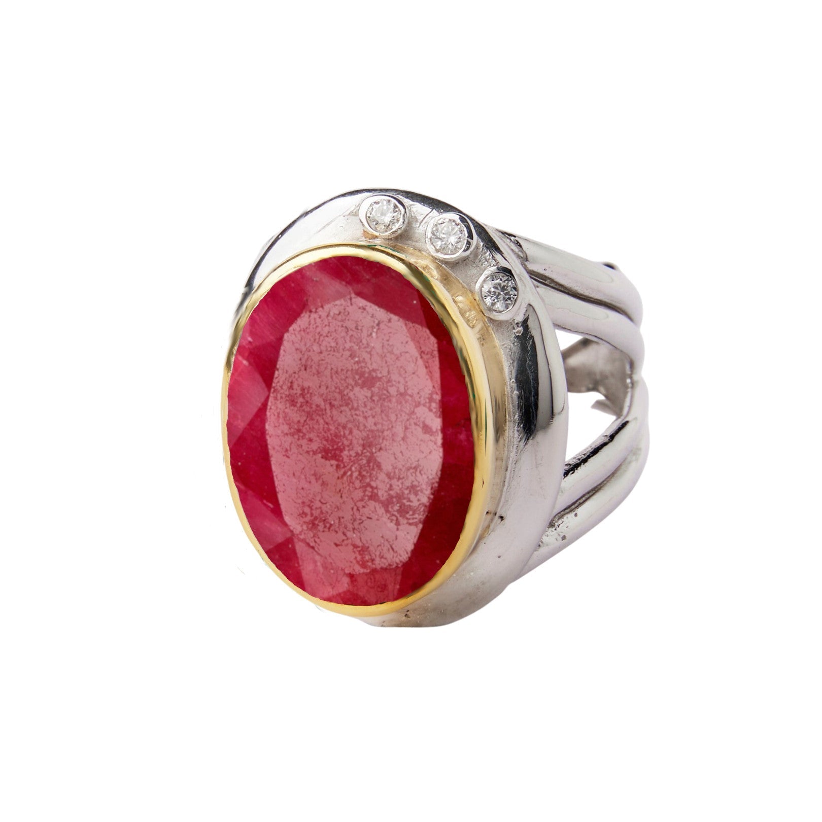 A statement **Eyetelia Ring in various gemstones** by **Gallardo & Blaine Designs** featuring a large oval-shaped red gemstone in a gold setting, flanked by three small round diamonds on the top of the band. This exquisite piece effortlessly combines colo