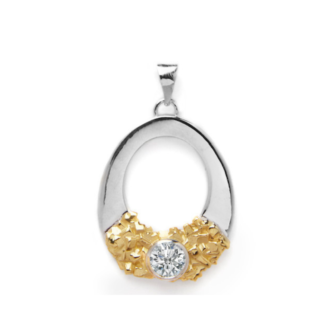 The Giselle Pendant by Gallardo & Blaine Designs boasts an elegant oval loop design, combining sterling silver and gold tones. The bottom of the oval is beautifully adorned with delicate gold clusters, which cradle a single, prominent round gemstone at th