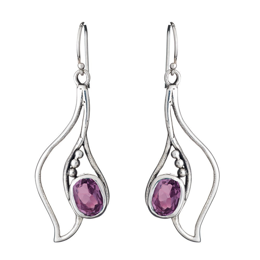Introducing the Iris Earrings in various gemstones from Gallardo & Blaine Designs: a pair of elegant silver & gold drop earrings featuring an abstract, wavy design. Each earring is adorned with a purple gemstone in an oval shape, surrounded by small silve