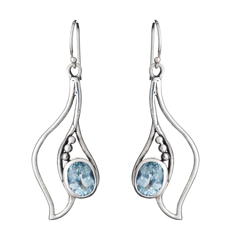 The Gallardo & Blaine Designs Iris Earrings in various gemstones feature wavy, abstract shapes crafted from silver & gold, adorned with oval blue gemstones. These elegant gemstone earrings have hook closures and are accented with small silver beads beside