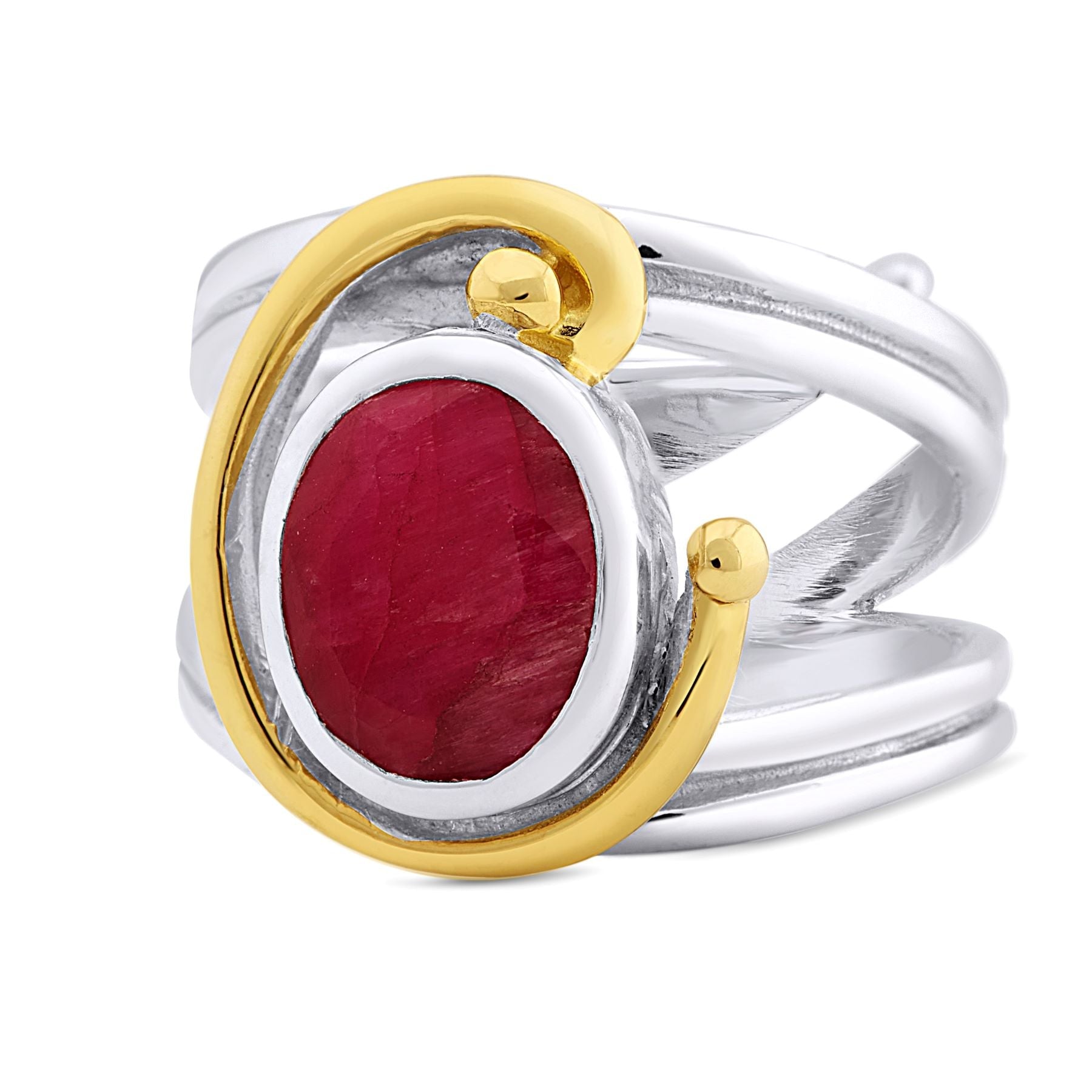 A silver Jasmine Ring in various gemstones by Gallardo & Blaine Designs featuring a large, oval-shaped red gemstone at its center, accentuated with a gold swirl design on one side and gold details. The band's design includes crisscrossing silver strands, 