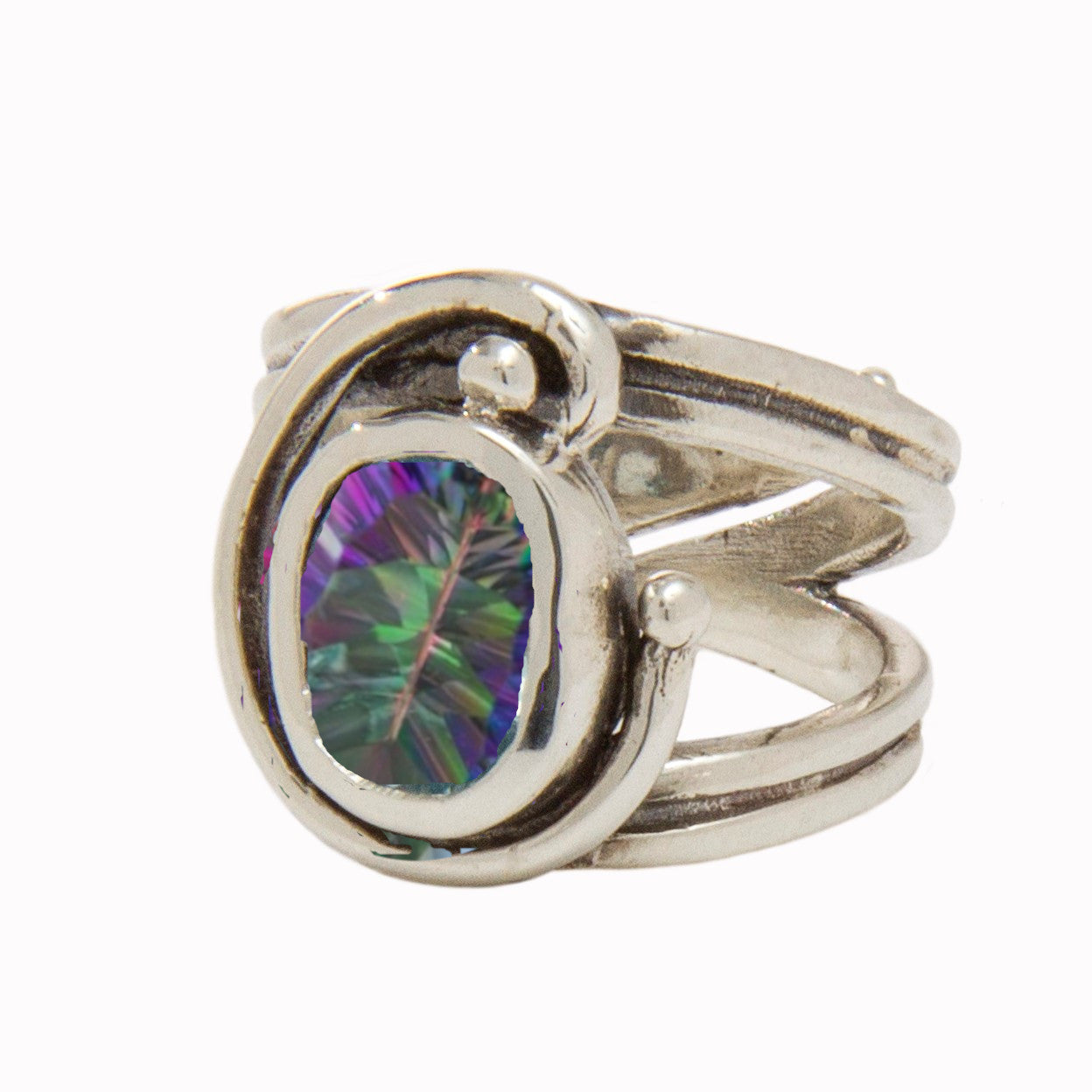 A stunning Art Nouveau ring featuring an abstract, swirled design with a prong setting that holds a large, oval-shaped, multicolored gemstone at its center. The gemstone displays a vivid, iridescent spectrum of teal, purple, and green hues. This exquisite